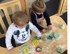 A group of children playing with dough